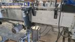 Etiquetadora autom�tica de doble cabezal para botellas planas Bauch Campos