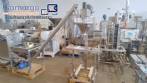 Sistema de llenado de polvo con transportador de silo de tornillo y llenador de tornillo