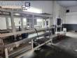 M�quina de llenado rotativa de acero inoxidable para bebidas carbonatadas y refrescos, 42 boquillas, KHS con lavadora Zegla.