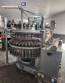 M�quina de llenado rotativa de acero inoxidable para bebidas carbonatadas y refrescos, 42 boquillas, KHS con lavadora Zegla.