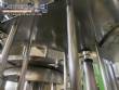 Llenadora rotativa gravimtrica de acero inoxidable con cabina