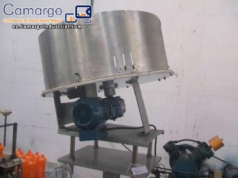 Alimentador de tapas y rotaci�n del posicionador