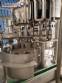 M�quina de llenado rotativa Zegla con sistema de enjuague y taponado de tres bloques